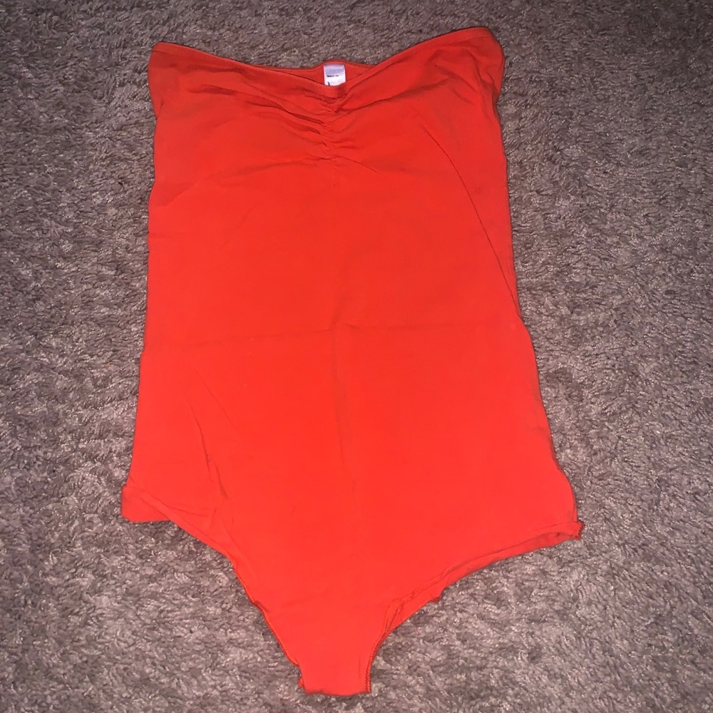 Orange body suit